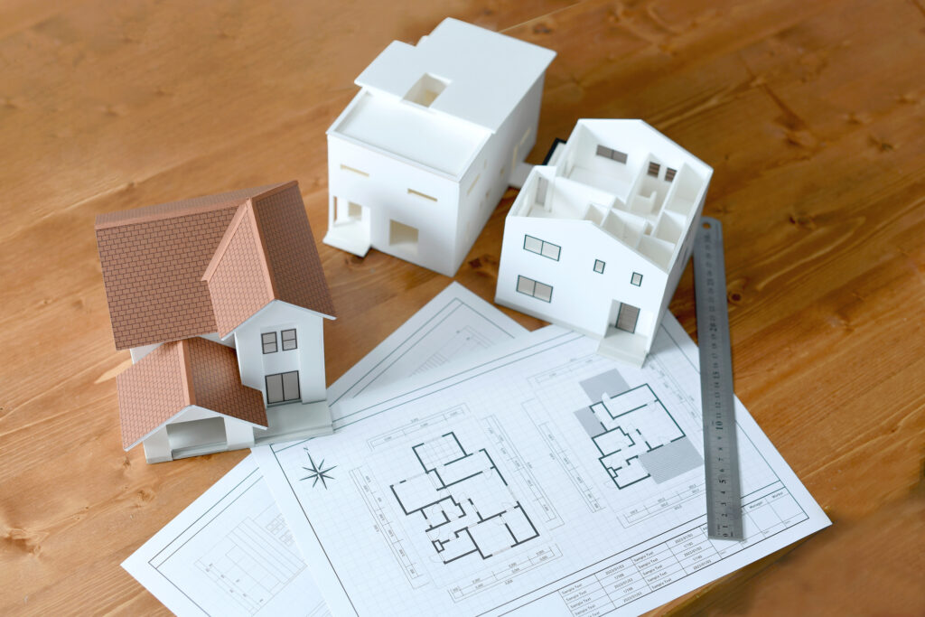 Models of houses with floor plans for a home remodel