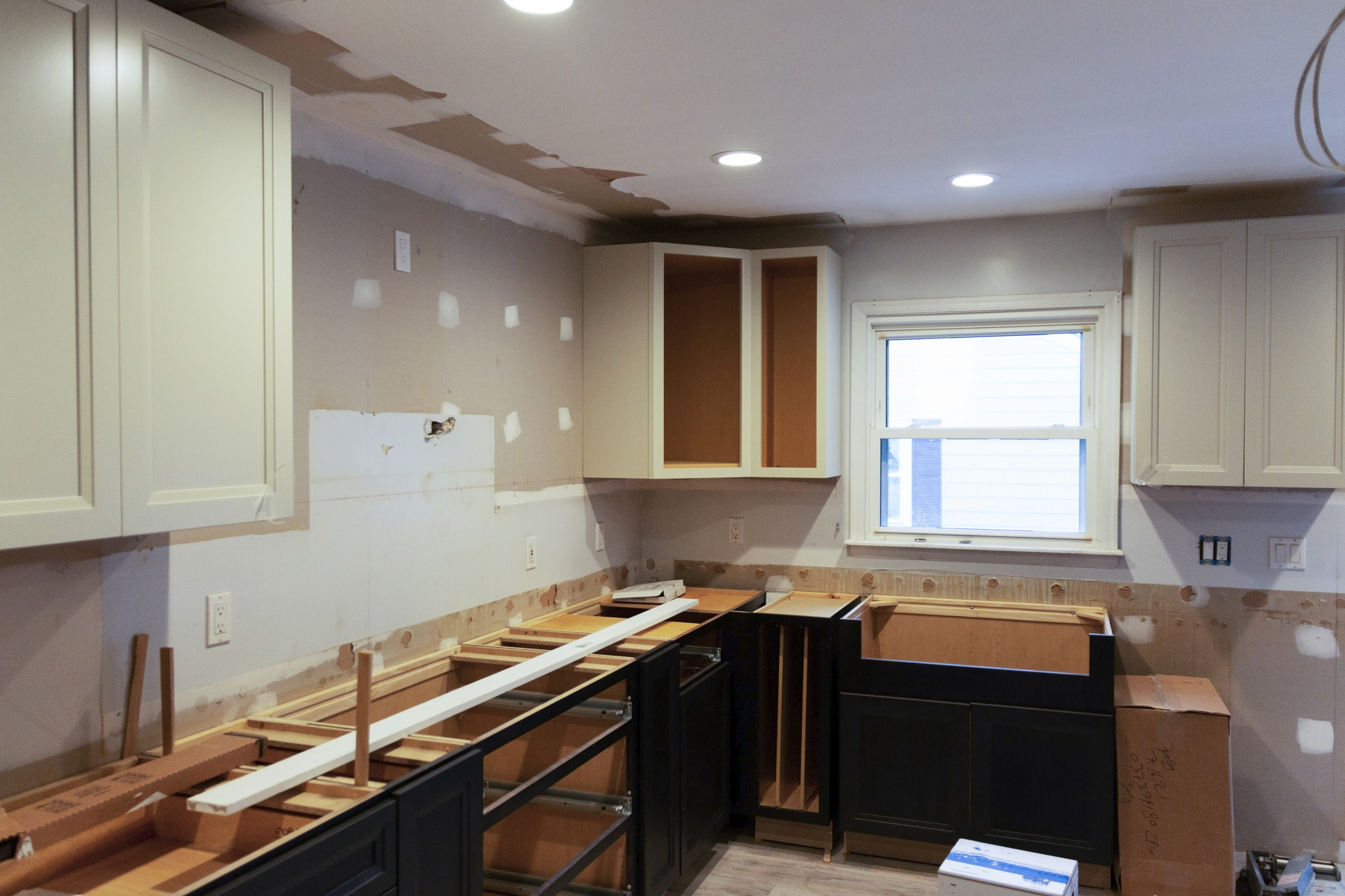A residential house installing a new kitchen with some of the cabinets put into place